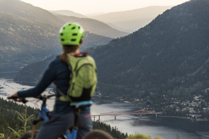 Mountain biker overlooking Nelson's Orange Bridge